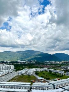 an aerial view of a city with buildings and mountains at Netflix l Chill Studio Kampar Champs Élysées in Kampar