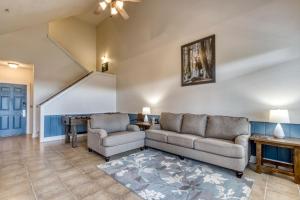 a living room with two couches and a table at Owl See You 3205 - Close to Dollywood and Overlooking Gatlinburg Golf Course condo in Pigeon Forge