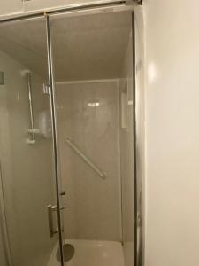a shower with a glass door in a bathroom at Parkview in Hoo