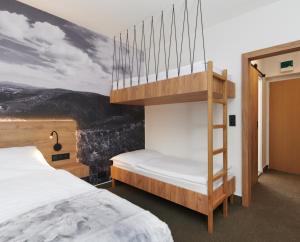Posteľ alebo postele v izbe v ubytovaní Wellness Hotel Svornost