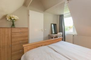 Postel nebo postele na pokoji v ubytování Vakantiewoning Domburg dichtbij strand, Kanonweistraat 12a