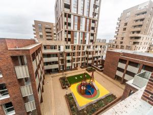 an aerial view of a playground in a city at Pass the Keys Spacious Bright Flat 20 Mins To Central London in London