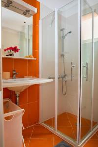a bathroom with a shower and a sink at Villa Andromeda in Sivota +42 photos