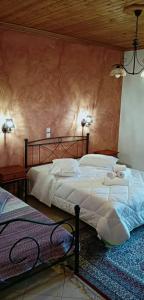 Ένα ή περισσότερα κρεβάτια σε δωμάτιο στο Ξενώνας Ερυκίνη