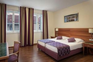 Postel nebo postele na pokoji v ubytování Hotel Galileo