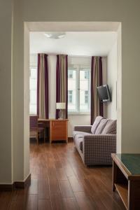 TV a/nebo společenská místnost v ubytování Hotel Galileo