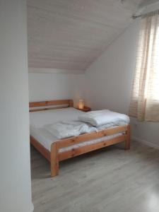 Łóżko lub łóżka w pokoju w obiekcie Kaszuby To Tu