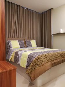 Kama o mga kama sa kuwarto sa Adria Residences - Ruby Garden - 2 Bedroom for 4 person