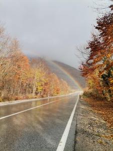 a rainbow on the side of a road at Apartman Mislav in Gračac