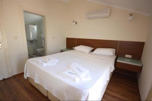 Postel nebo postele na pokoji v ubytování SUNSET BEACH CLUB LEBRENTALS