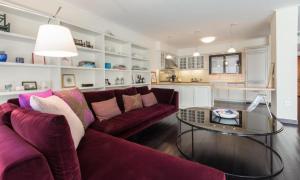 a living room with a couch and a glass table at Athens Plaka Hill luxury Flat in Athens