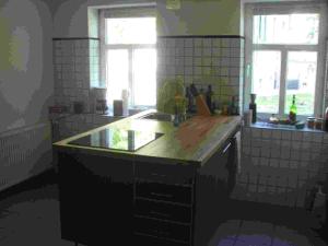 a kitchen with a large island in the middle at Ferienwohnung Henning am Schwielochsee in Friedland