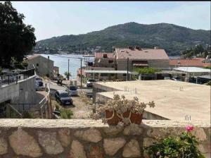 a view of a parking lot next to the water at Apartments Fig&Olive in Zaton