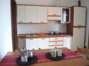 A kitchen or kitchenette at Adorable apartment with swimming pool
