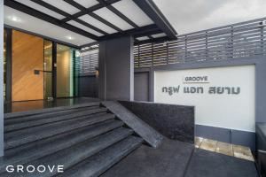 a lobby of a building with a staircase at GROOVE AT SIAM in Pom Prap