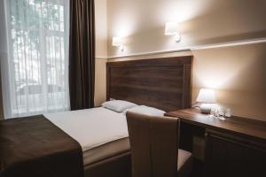 Postel nebo postele na pokoji v ubytování Potemkinn Hotel