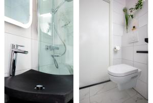 代爾夫特的住宿－2 Double floor Delft City Centre new family apartment，带淋浴和卫生间的白色浴室