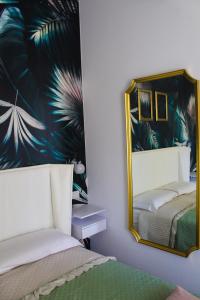 A bed or beds in a room at Lion Luxury rooms