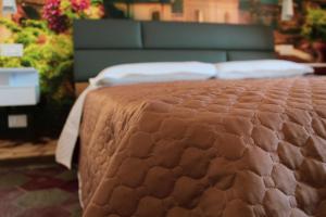 A bed or beds in a room at Lion Luxury rooms