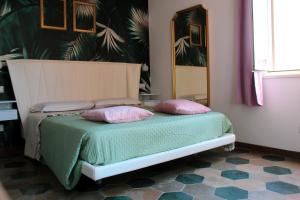 A bed or beds in a room at Lion Luxury rooms