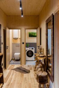 a room with a kitchen with a stove and a table at Apartmán pod Demänovskou horou in Demanovska Dolina