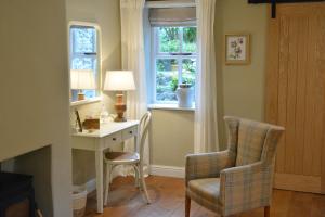 a home office with a desk and a window at Beckside Cracoe in Skipton