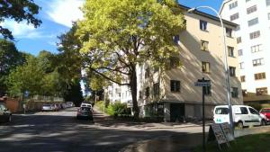 a street with cars parked on the side of a building at Quite room in apartement in Oslo