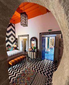 a room with a view of a room with a mirror at Salut Maroc! in Essaouira