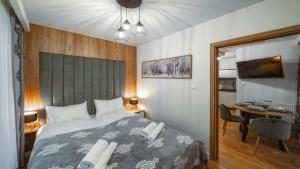 Posteľ alebo postele v izbe v ubytovaní Resorts E Białka Tatrzańska z sauną, Sun & Snow