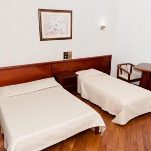 Cama o camas de una habitación en Castelar Novo Hotel
