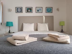 Кровать или кровати в номере Casa do Alto