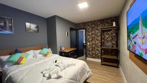 Cama ou camas em um quarto em Hotel La Serena