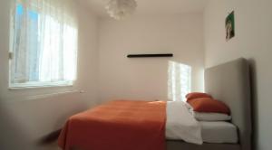 Postel nebo postele na pokoji v ubytování Two Flowers Apartments