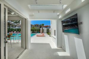 a view from the hallway of a house with a tv on the wall at Cocoοns Suites & Villas Fourka in Fourka