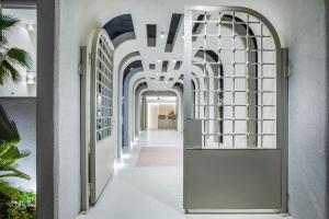 a hallway with a door in a building at Cocoοns Suites & Villas Fourka in Fourka