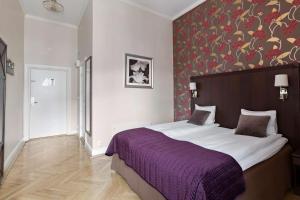 Postel nebo postele na pokoji v ubytování Best Western Vetlanda Stadshotell