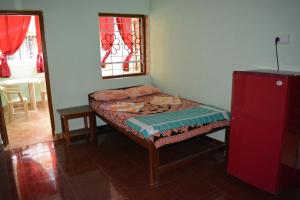 Postel nebo postele na pokoji v ubytování Vailankanni Guesthouse + 18 fotografií