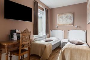 TV a/nebo společenská místnost v ubytování Best Western Vetlanda Stadshotell