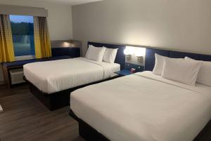 Postel nebo postele na pokoji v ubytování Microtel Inn & Suites by Wyndham Rehoboth Beach