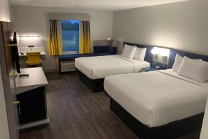Postel nebo postele na pokoji v ubytování Microtel Inn & Suites by Wyndham Rehoboth Beach