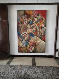 a picture of a painting on a wall at AYAHAY SA MATUTINA in Puerto Princesa City