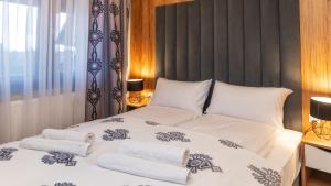 Posteľ alebo postele v izbe v ubytovaní Resorts E Białka Tatrzańska z sauną, Sun & Snow