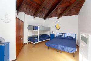 Ένα ή περισσότερα κρεβάτια σε δωμάτιο στο Villa Smeralda