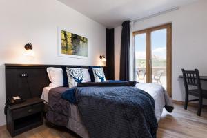 Postel nebo postele na pokoji v ubytování Hotel Iris