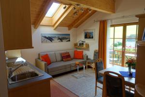 a living room with a couch and a table at Haus Lubach in Kals am Großglockner