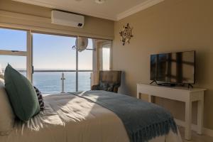 Ένα ή περισσότερα κρεβάτια σε δωμάτιο στο 603 Villa Royale +54 φωτογραφίες