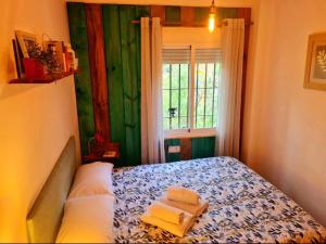 Postel nebo postele na pokoji v ubytování La Casa Junto al Sendero del Río & Piscina # aire acondicionado