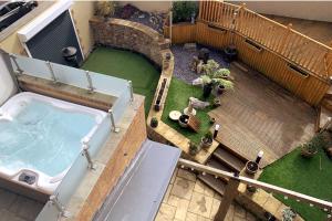 an overhead view of a hot tub in a backyard at Ffynonn Wen in Llandrillo-yn-Rhôs