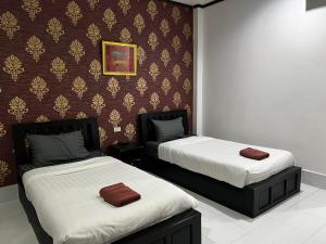 En eller flere senge i et værelse på บ้านบัวรีสอร์ท