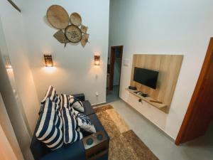 TV a/nebo společenská místnost v ubytování Pousada Raroguis - Praia de Guaratiba